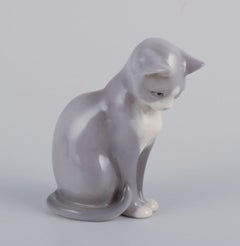 Royal Copenhagen. Porcelain figurine of a sitting cat. 21st C.