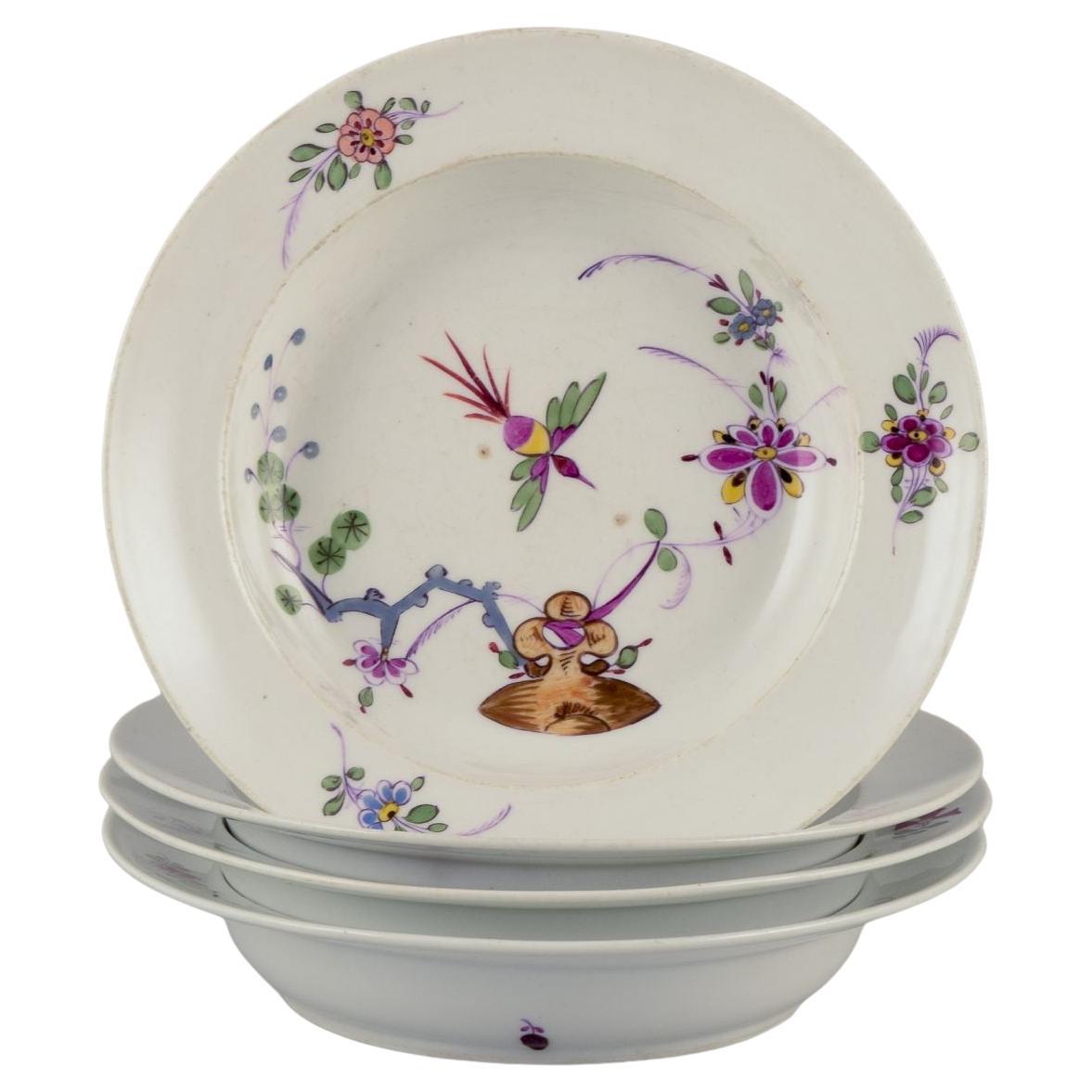Meissen, Allemagne. Ensemble de quatre assiettes creuses en porcelaine. A.I.C..
