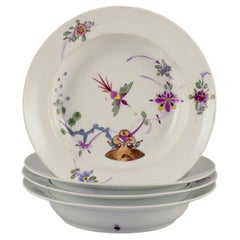 Meissen, Allemagne. Ensemble de quatre assiettes creuses en porcelaine. A.I.C..