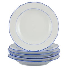 Meissen, Germany. Set of six dinner plates. White porcelain with blue rim.