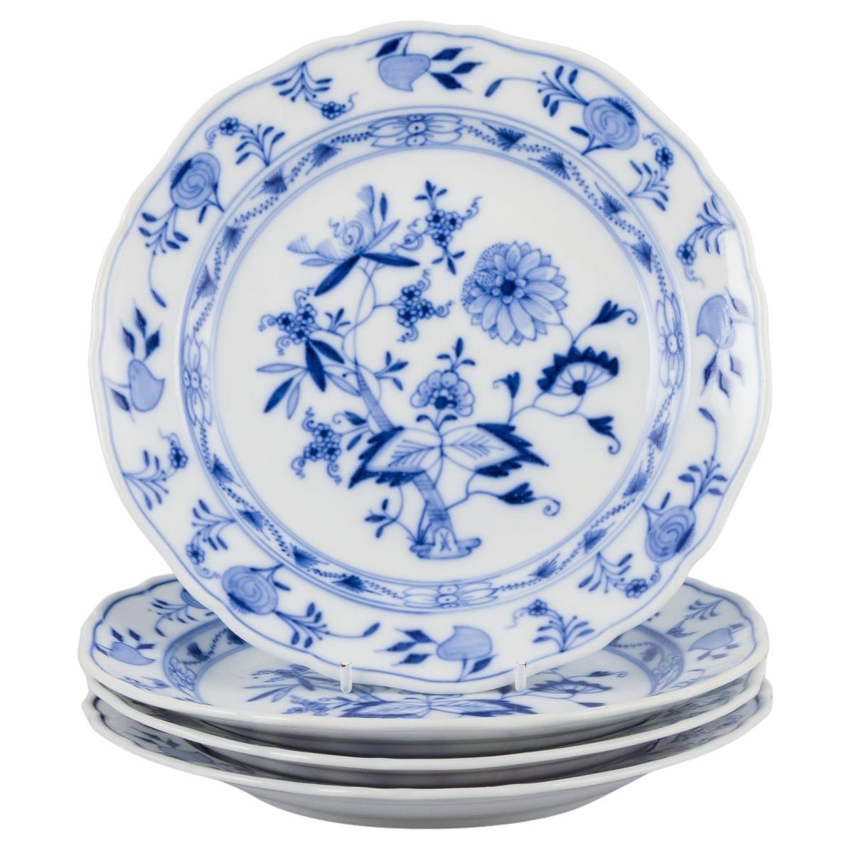 Meissen, Germany. Set of four "Blue Onion" pattern porcelain plates.
