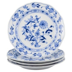 Meissen, Germany. Set of four "Blue Onion" pattern porcelain plates.