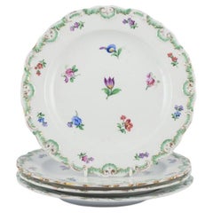 Meissen, Germany.  Set of four antique porcelain plates. Hand-decorated, 19th C.