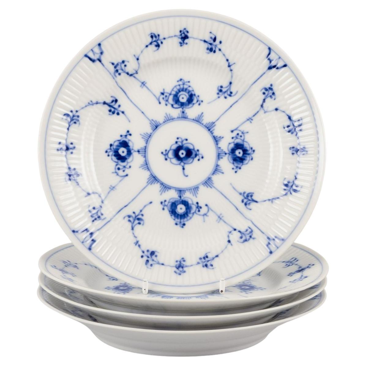 Royal Copenhagen Blau geriffelte Plain. Satz von vier kleinen Tellern aus Porzellan.