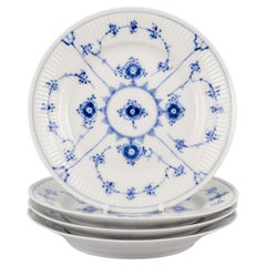 Royal Copenhagen Blau geriffelte Plain. Satz von vier kleinen Tellern aus Porzellan.