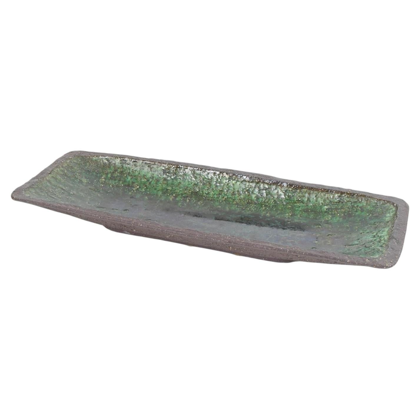Hegnetslund, Denmark. Elongated stoneware dish with green glaze. 1960s For Sale