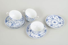 Royal Copenhagen. Blue Fluted Half Lace. Set of five cups and saucers, 1920s.