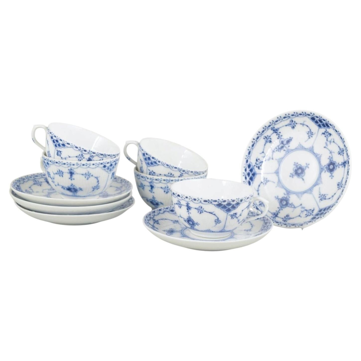 Royal Copenhagen. Blue Fluted Half Lace. Set of five cups and saucers, 1920s.