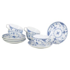 Royal Copenhagen. Blue Fluted Half Lace. Set of five cups and saucers, 1920s.