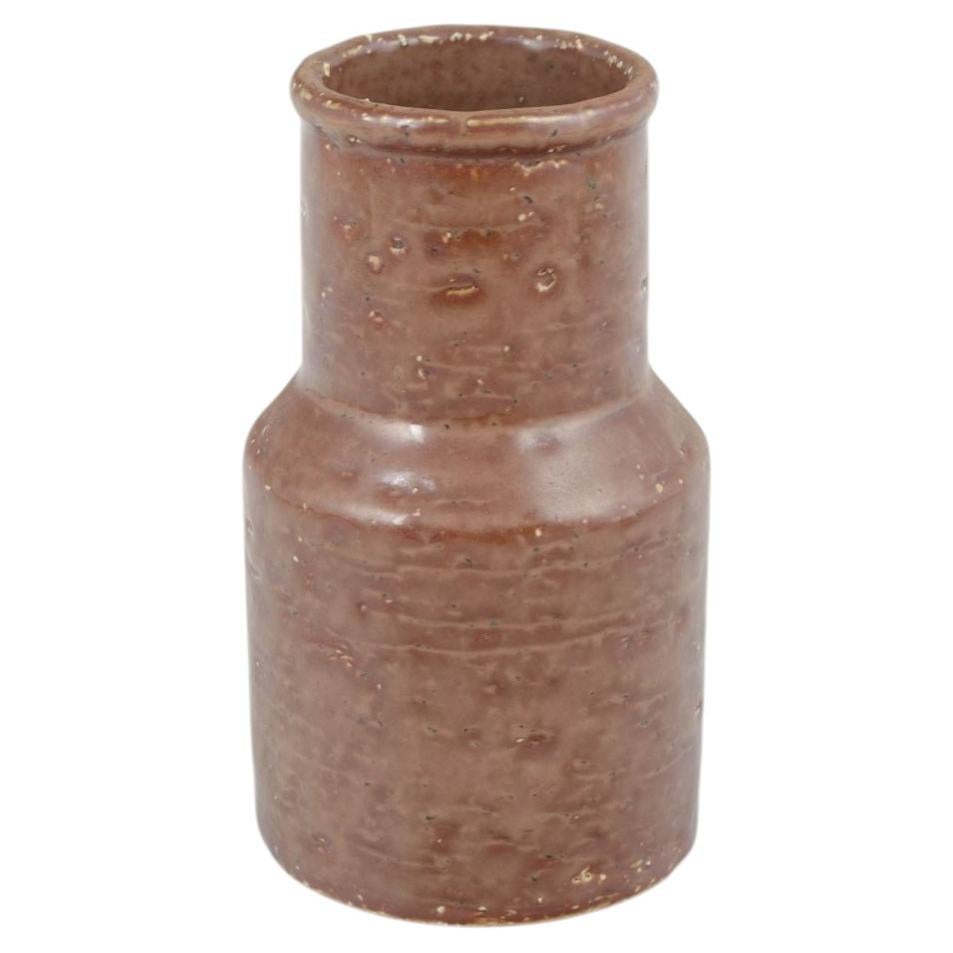 European Studio Ceramicist. Cylindrical vase with brown glaze. 1970s For Sale