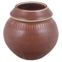Rörstrand. Bulbous stoneware vase with subtle vertical ribbing. Mid-20th C.