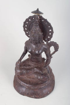 Figura budista sentada, realizada en bronce patinado. Asia, siglo XIX