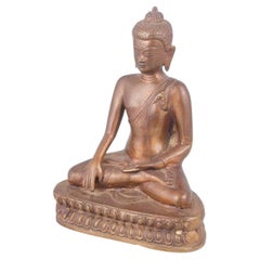 Statua di Buddha seduto in bronzo patinato, in classica posa meditativa. XIX secolo