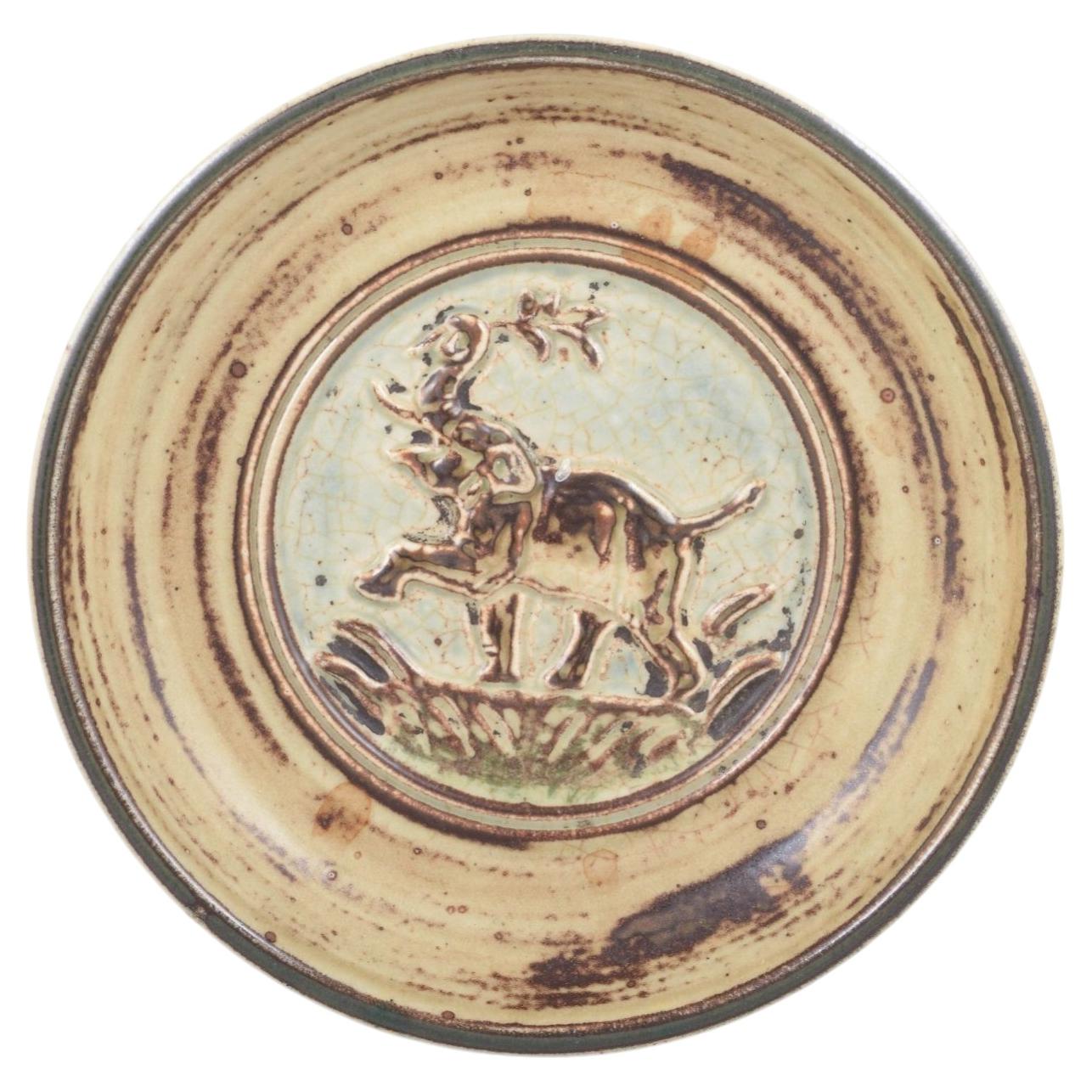 Knud Kyhn for Royal Copenhagen. Round stoneware dish with relief of elephant. For Sale