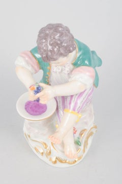 Meissen, Germany. Porcelain figurine of boy squeezing grapes. Early 20th C.