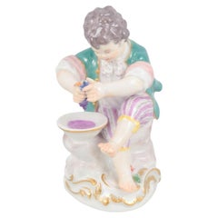 Meissen, Germany. Porcelain figurine of boy squeezing grapes. Early 20th C.