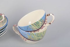 Gien, "Savane". Set of four faience coffee cups with matching saucers.