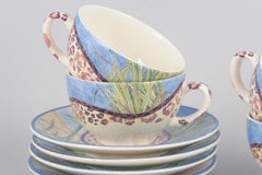 Gien, "Savane". Set of four faience coffee cups with matching saucers.