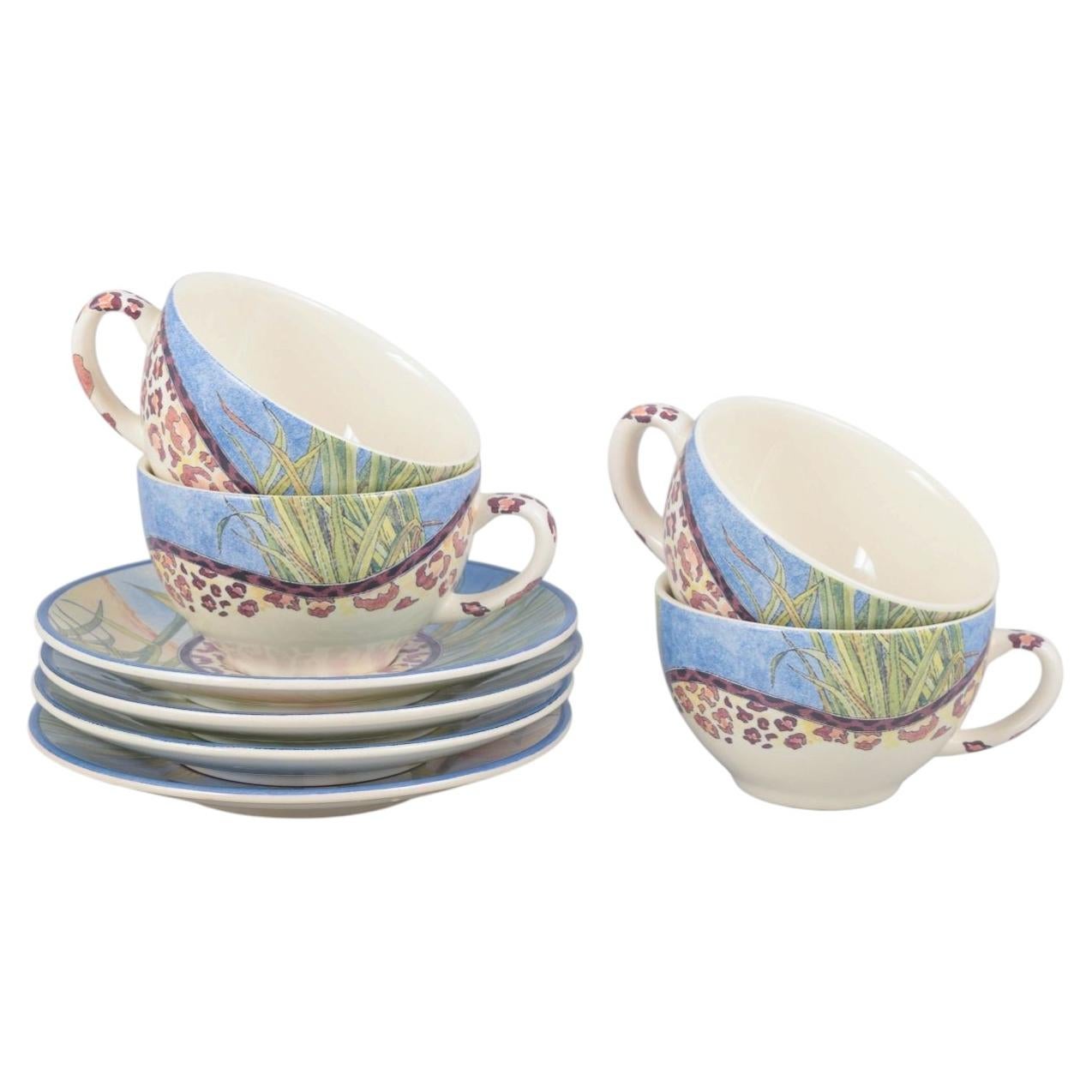 Gien, "Savane". Set of four faience coffee cups with matching saucers. For Sale