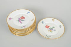 Rosenthal. Set of twelve porcelain plates with floral motifs. 1930s