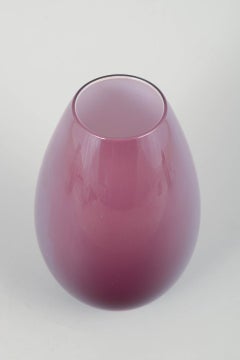 Peter Svarrer for Holmegaard. “Cocoon” vase in deep purple glass. Late 20th C.