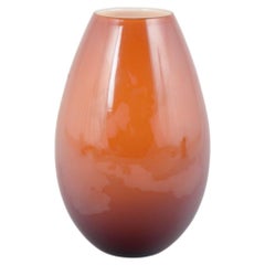 Peter Svarrer for Holmegaard. “Cocoon” vase in warm orange glass. 20th C.