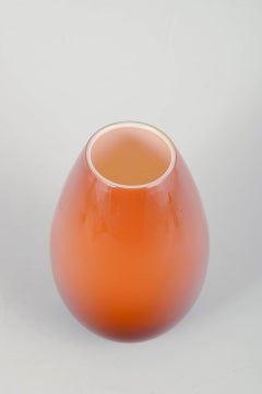 Peter Svarrer for Holmegaard. “Cocoon” vase in warm orange glass. 20th C.