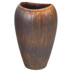 Gunnar Nylund for Rörstrand. Stoneware vase with brown and amber running glaze.