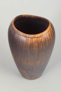 Gunnar Nylund for Rörstrand. Stoneware vase with brown and amber running glaze.