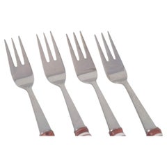 Bjørn Wiinblad for Rosenthal. Four cake forks in stainless steel and porcelain.