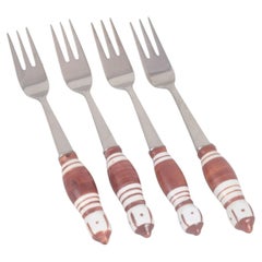 Bjørn Wiinblad for Rosenthal. Four cake forks in stainless steel and porcelain.