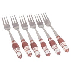 Bjørn Wiinblad for Rosenthal. Six cake forks in stainless steel and porcelain.