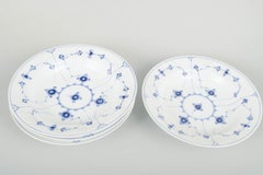 Royal Copenhagen, Blue Fluted Plain. Four deep plates in porcelain. 1920s