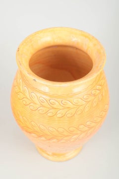Kähler. Tall yellow-orange ceramic vase with incised leaf pattern, 1930s