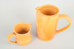 Kähler, Denmark. Two large ceramic pitchers. Yellow-orange glaze. 1930s