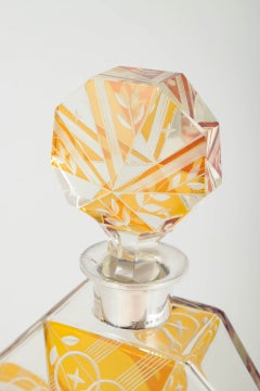 Art Deco decanter in faceted crystal glass with silver mounting. Sweden 1920/30s