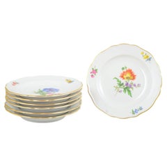 Meissen, Germany. Set of seven side dishes in porcelain with floral motifs.
