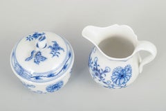 Meissen. Set of "Blue Onion" sugar bowl and creamer in porcelain, mid-20th C.