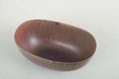 Carl-Harry Stålhane for Rörstrand. Oval stoneware bowl with reddish-brown glaze.