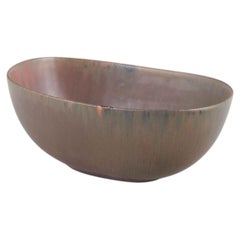 Carl-Harry Stålhane for Rörstrand. Oval stoneware bowl with reddish-brown glaze.