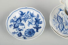 Meissen, Blue Onion. Four porcelain espresso cups with saucers. Early 20th C.