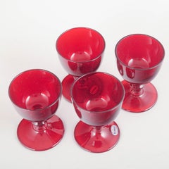 Reijmyre Glasbruk. Set of four ruby-red port wine glasses, 1950s