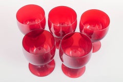 Monica Bratt for Reijmyre Glasbruk. Set of five ruby-red wine glasses, 1950s