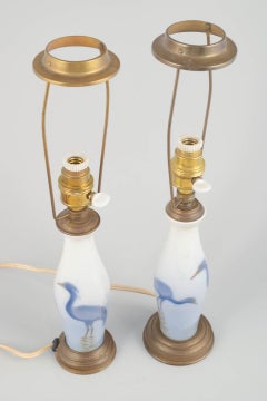 Pair of small table lamps with heron motifs. Porcelain and brass, early 20th C