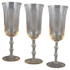 Simon Gate for Orrefors. Three champagne "Salut" glasses with amber tint. 1970s
