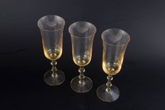 Simon Gate for Orrefors. Three champagne "Salut" glasses with amber tint. 1970s
