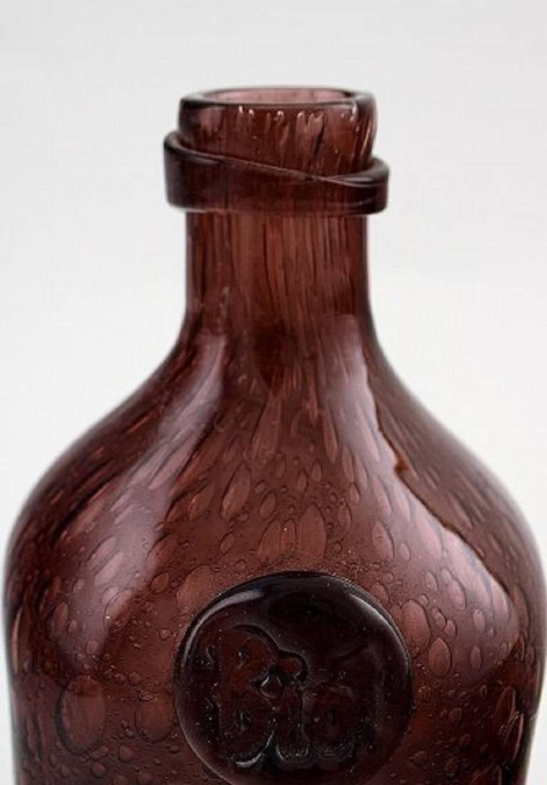 Biot, France.
Unique glass bottle, late 1900s.
Violet glass with bubbles.
Stamped.
Measures 14 cm.