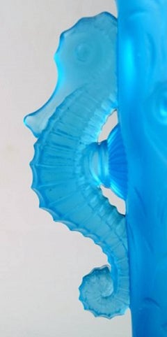 Lalique style art glass vase in turquoise with seahorses in relief.