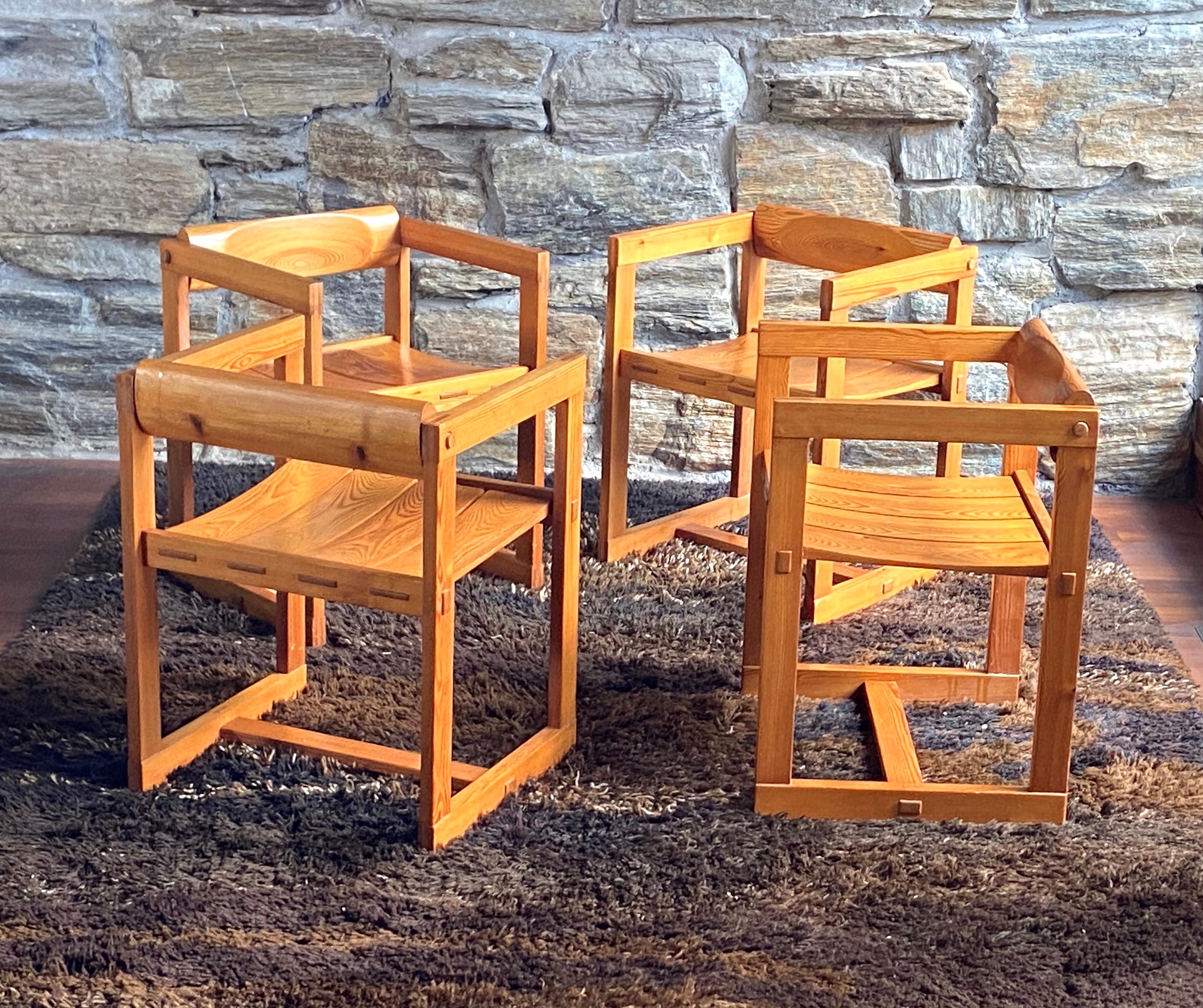 Fantastic and rare set of four brutalist  pine chairs designed by Norwegian designer Edvin Helseth - these are model 313 chairs for his Tyrbo series, made by Stange Bruk in Norway in the 1960's.
Beautiful construction with through mortise and tenon