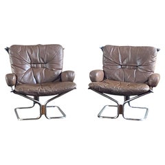 Pair of Norwegian leather and chrome Harald Relling lounge chairs for Westnofa